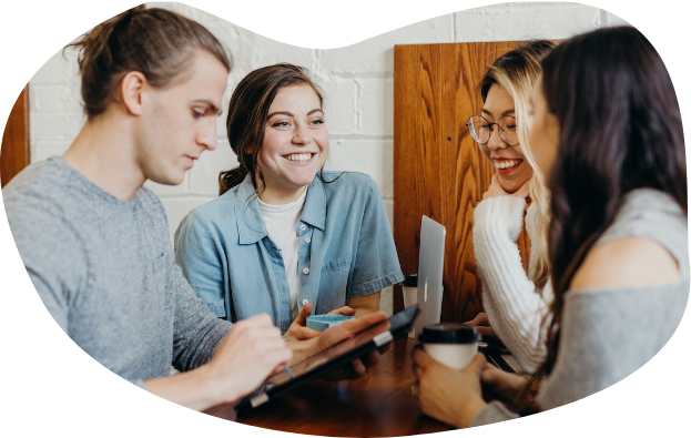 People smiling at a table